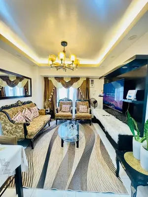 a living room with a couch and a table at Condo in Manila in Manila
