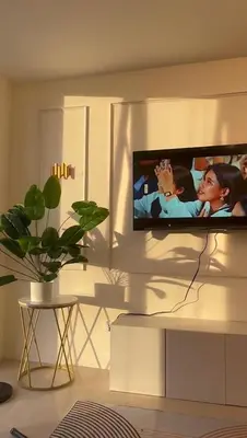 a flat screen tv on a wall in a living room at Apartment in Pasig-khairo Residences in Manila