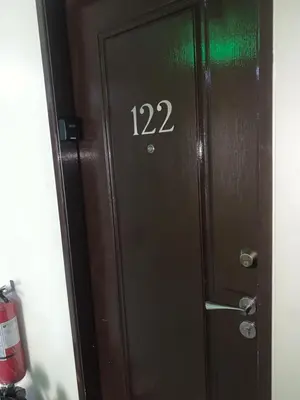 a door with the number on it at M&L Condotel in Santo Domingo