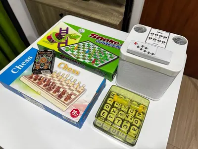 a lego chess game and a toy machine on a table at Casa Dreamer in Taytay
