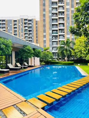 a large swimming pool in a city with tall buildings at Casa Dreamer in Taytay