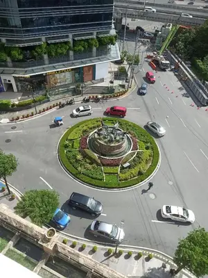 a roundabout with cars parked in a parking lot at 150 Newport Boulevard - North Wing in Manila