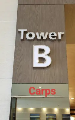 a sign for a tovyben caraves store at Carps Staycation in Manila