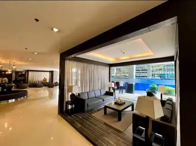 a living room with a couch and a table at SLY Staycation at Shore U-8 in Manila