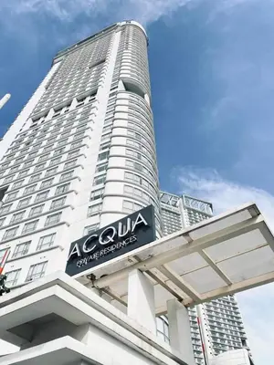 a large building with a sign on the side of it at Aveline Suites Sunrise 2bedroom in Manila