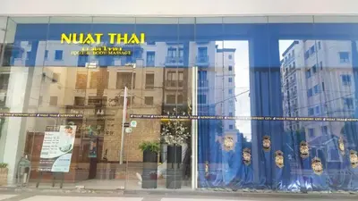 a window of a building with a nart titan sign on it at Cozy condy at One palm villa across NAIA T3 in Manila