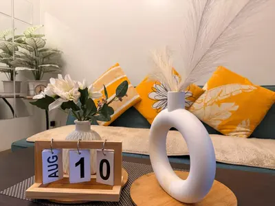 a coffee table with a coffee mug and a calendar at Shore 2 Tower 1 Eliel Staycation in Manila