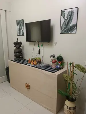 a tv on top of a dresser in a room at Sea residence in Manila