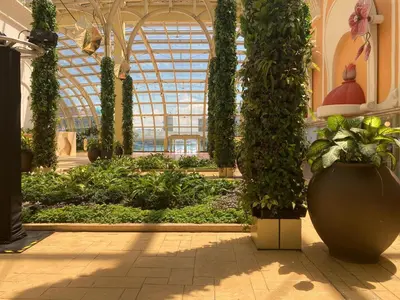 a large greenhouse with plants in a building at Bright Condo-Gentry Manor 2 mins to Okada - 6G in Manila