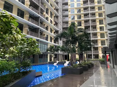 a swimming pool in the middle of a building at Bright Condo-Gentry Manor 2 mins to Okada - 6G in Manila