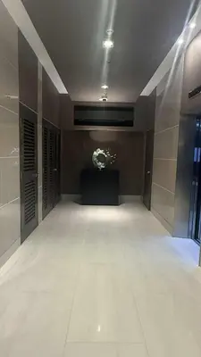 a large empty room with a stage in a building at Shore Residecnes Infront of MoA, Netflix, Wifi in Manila