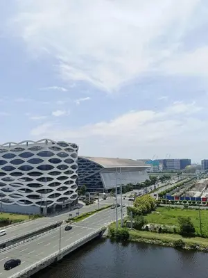 a highway next to a large building and a road at WP1015 with Balcony in Manila