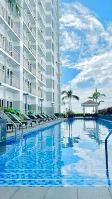 a large swimming pool in front of a building at Near SM MOA in Manila