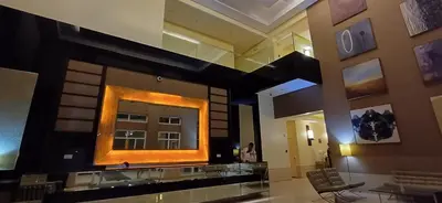 a large mirror on the wall of a lobby at Cozy Haven in Manila