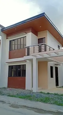 a house with a balcony in front of it at Von Home Sweet Home in Dasmariñas