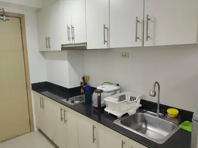 a kitchen with a sink and a counter top at Sea Residences, Pkwy, Pasay City 1300, Philippines in Manila