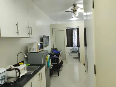 a kitchen with a sink and a counter top at Sea Residences, Pkwy, Pasay City 1300, Philippines in Manila