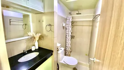 a bathroom with a sink and a toilet at Stunning view staycation near MOA PICC WORLD TRADE CENTER AIRPORT LUNETA PARK MANILA OCEAN PARK QURINO GRANDSTAND in Manila