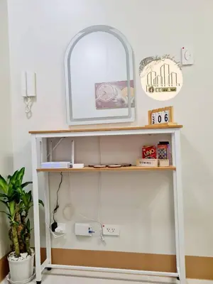 a shelf with a mirror on top of it at EcityStay in Manila