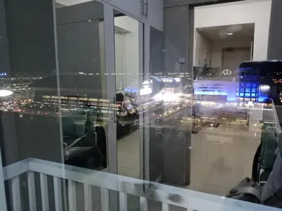 a glass window with a view of a city at Sea Residence Tower A by Stave in Manila