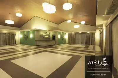 a large empty room with green walls and lights at Apartment in Parañaque in Manila