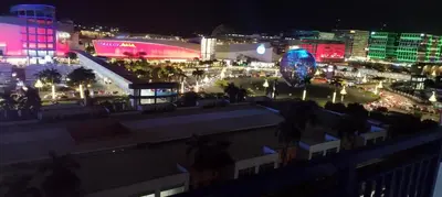 a view of a city at night with lights at Derick's Place at Sea Residences in Manila