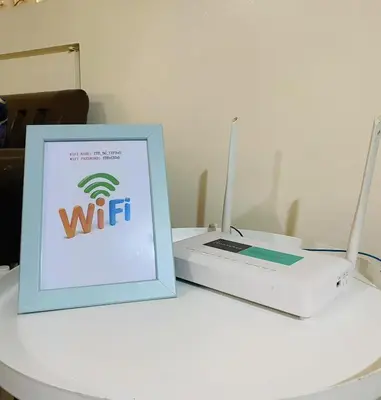 a white laptop computer sitting on top of a table at Stan Condo in Manila