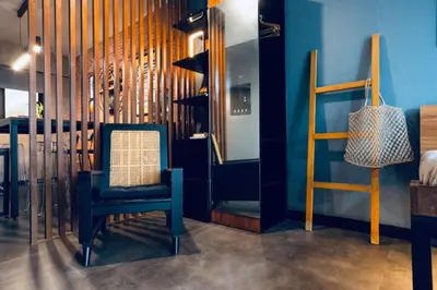 a blue room with a chair and a ladder at Functional stay near airport, business districts in Manila