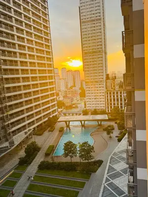 a view of a city skyline with buildings and a pool at KD's Home - Fast WiFi, Netflix , Pool , Karaoke in Manila