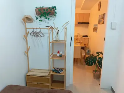 a room with a shelf and a room with a kitchen at Gale Haven in Manila