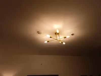 a ceiling light with a clock on the ceiling at Gale Haven in Manila