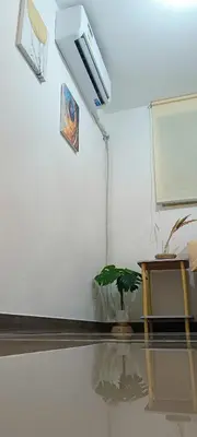 a room with a table and a basketball hoop at Gale Haven in Manila