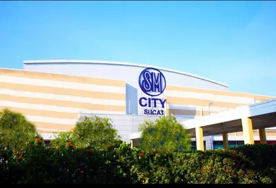 a large building with a sky city sign on it at Nyli Minimalist Suite in Manila