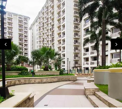 a walkway in front of a large apartment building at Solemare Parksuites in Manila