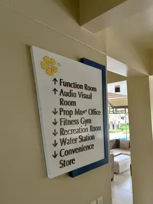 a sign hanging on a wall in a room at Tropical Hawaiian 2BR Condo Unit in Metro Manila with Laundry Area - Sleeps 4 in Manila
