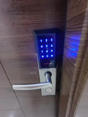 a close up of a door with a blue light on it at Florian's suite in Air Resideneces Makati in Manila