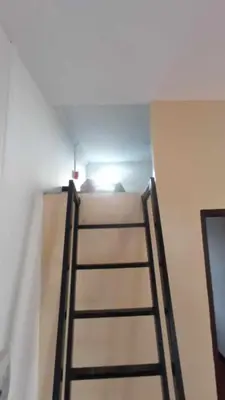 a ladder leaning against a wall in a room at Amaia Escapes Calamba in Calamba