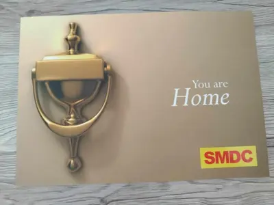 a sign that says you are home with a gold clock at 1 BR- with Balcony -Shore 2 Tw2 - Pasay MOA in Manila