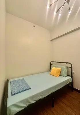 a small room with a bed in a room at Casa de Caysido in Manila