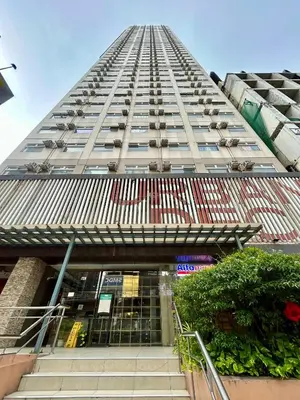 a tall building with stairs leading up to it at NIJECRIFIL Condotel in Manila