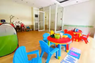 a room with a table and chairs and a tent at 5 mins SM Aura Cozy Studio Type in Manila