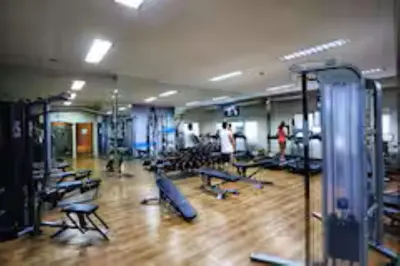 a gym with rows of chairs and a wooden floor at 5 mins SM Aura Cozy Studio Type in Manila