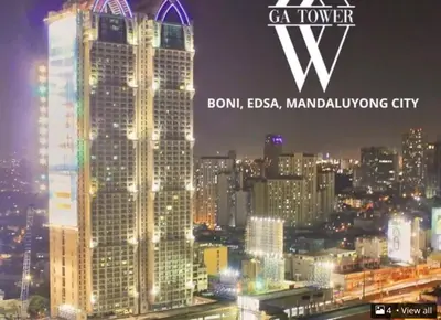 a view of a city skyline at night at Simple but cozy, feel at home in Manila