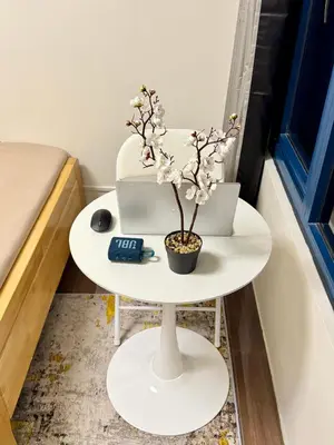 a white table with a cake on top of it at The Scandi Hub at Air Residences, Makati in Manila