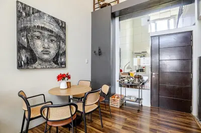 a dining room with a table and chairs at Huge 101-SQM 2BR in Central BGC Up to 12 Guests in Manila