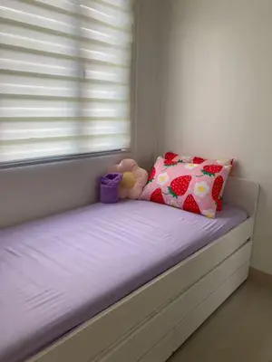 a small bed in a room with a window at LEAF RESIDENCES MUNTINLUPA - M&G Staycation in Manila