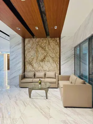 a living room with a couch and a table at Grand View Tower - Metro Stay in Manila