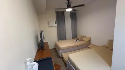 a small room with a bed and a couch at SplashNStay 18sqm condi near AUP,PNPA CKS College Sta Rosa Tagaytay road Silang Cavite in Puting Kahoy