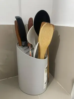 a white container filled with cooking utensils at Cozy Hideout-Free Parking, Netflix & Arcade Games in Cainta