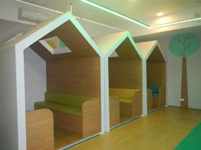 a room with two beds with a tree on the wall at Two Maridien 41stFlr Studio -Minimalist Functional in Manila
